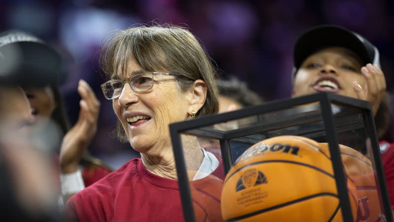 Stanford head coach Tara VanDerveer accepts an award for winning her 1,000th career game after the team won an NCAA college basketball game against Utah for the Pac-12 tournament championship Sunday, March 6, 2022, in Las Vegas.