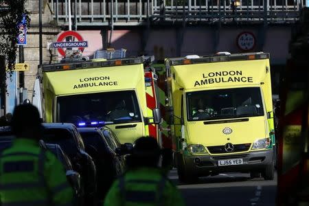 Police, fire and ambulance crew attend to an incident at Parsons Green underground station in London, Britain, September 15, 2017. REUTERS/Luke MacGregor/Files