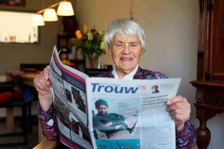 Clara Jas reads a newspaper in her house in Zwolle, the Netherlands April 3, 2018. Picture taken April 3, 2018. REUTERS/Michael Kooren