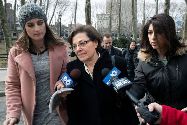 Nancy Salzman, center, is surrounded by reporters as she arrives at Brooklyn federal court, Wednesday, March 13, 2019, in New York. Salzman, a co-founder of NXIVM, an embattled upstate New York self-help organization, is expected to plead guilty in a case featuring sensational claims that some followers became branded sex slaves. (AP Photo/Mary Altaffer) (Photo: via Associated Press)