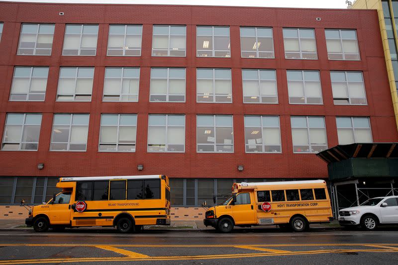 FILE PHOTO: School busses are parked outside a school in Brooklyn, New York