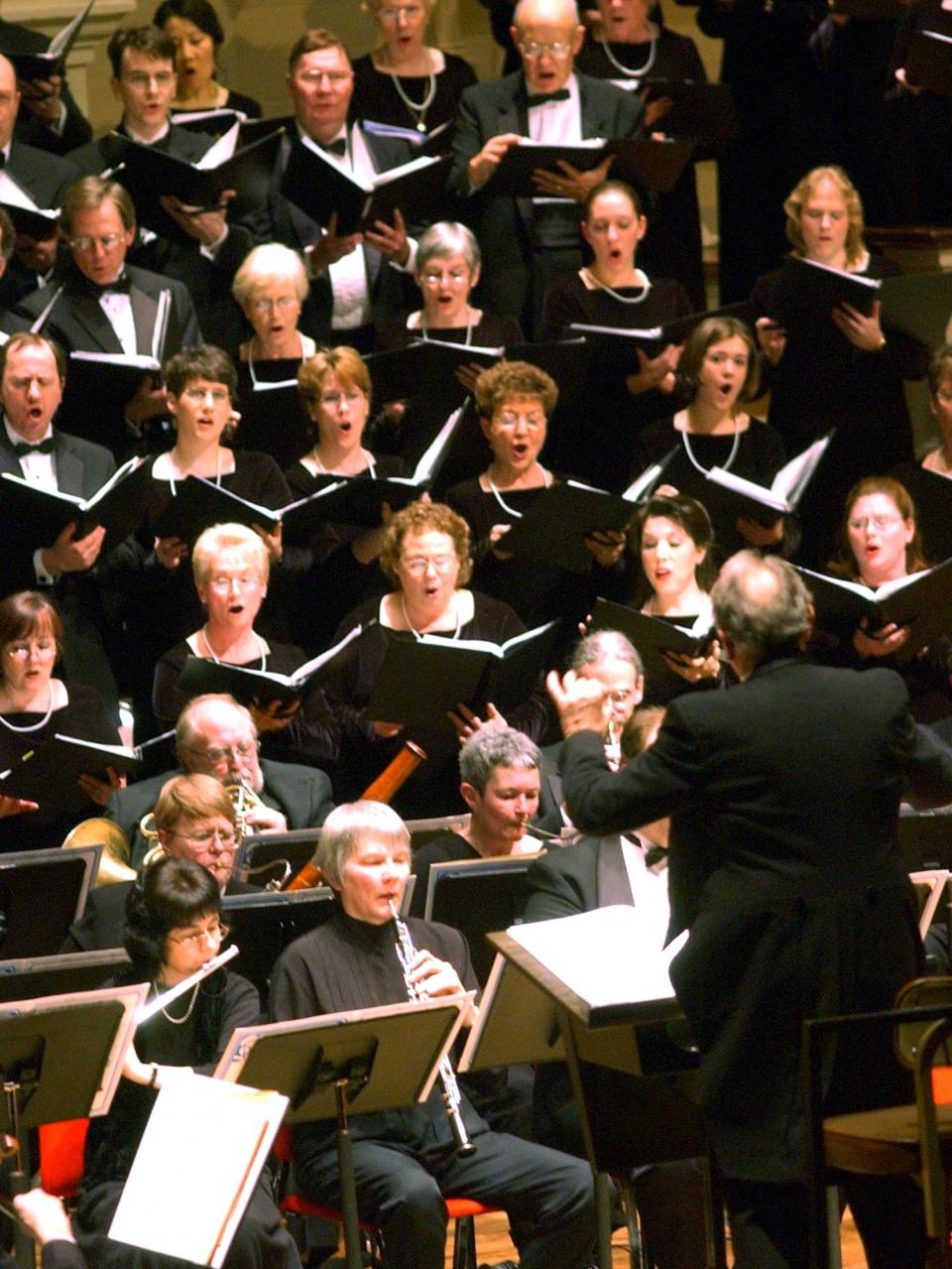 Gerald Mack directing the Worcester Chorus and Worcester Symphony Orchestra at Mechanics Hall in 2003. Mack led the chorus for 28 years, retiring in 2005.