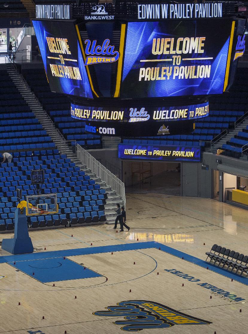 In this photo taken Tuesday, Oct. 23, 2012, a new video board at Pauley Pavilion on the UCLA campus in Los Angeles. The UCLA Bruins honor their championship past and address the future in the $132 million renovation to be unveiled on Nov. 9 when they host Indiana State in their men’s basketball season opener. (AP Photo/Damian Dovarganes)