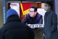 People watch a TV showing a file image of North Korean leader Kim Jong Un shown during a news program at the Seoul Railway Station in Seoul, South Korea, Thursday, Jan. 20, 2022. Accusing the United States of hostility and threats, North Korea on Thursday said it will consider restarting "all temporally-suspended activities" it had paused during its diplomacy with the Trump administration, in an apparent threat to resume testing of nuclear explosives and long-range missiles. (AP Photo/Ahn Young-joon)