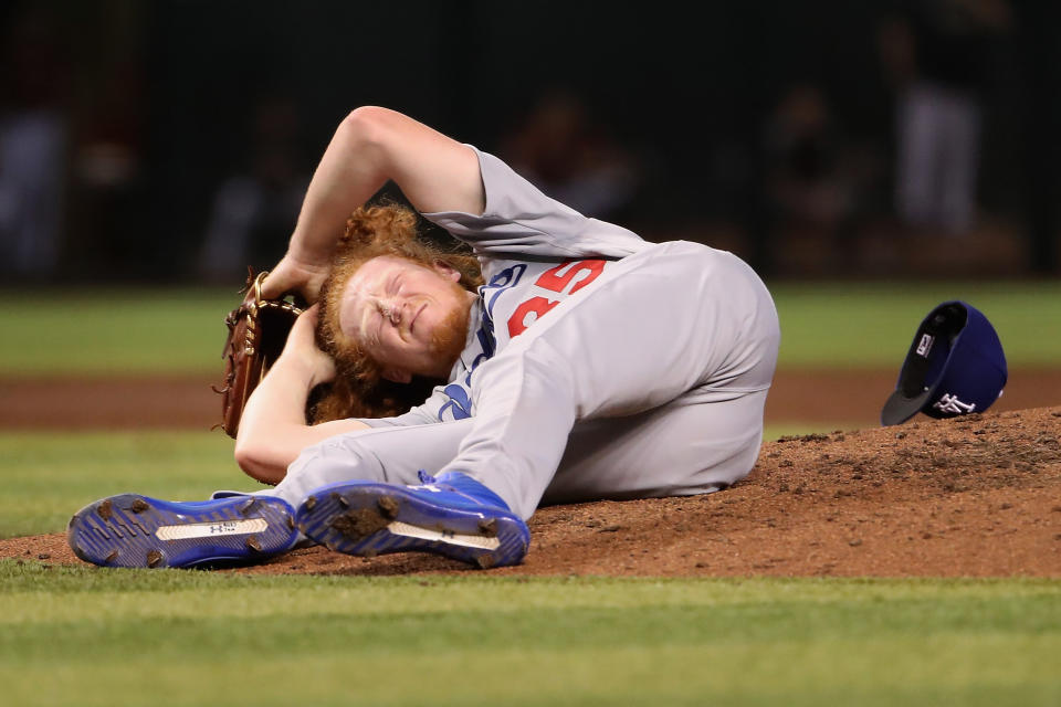 PHOENIX, ARIZONA - SEPTEMBER 01:  Relief pitcher Dustin May #85 of the Los Angeles Dodgers reacts after being hit by a line drive during the fourth inning of the MLB game against the Arizona Diamondbacks at Chase Field on September 01, 2019 in Phoenix, Arizona. (Photo by Christian Petersen/Getty Images)