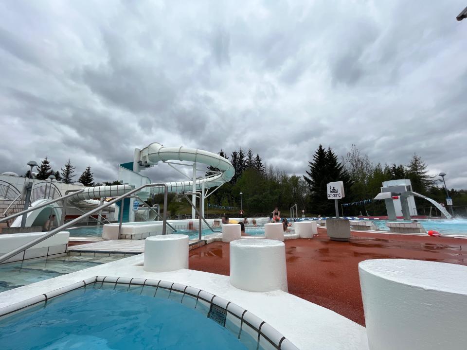 Outdoor pools with a waterslide.