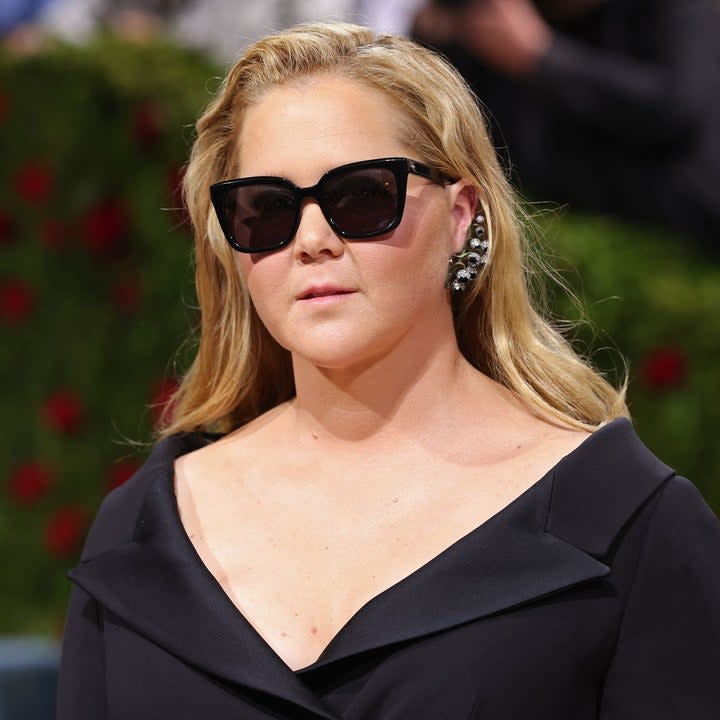 Amy Schumer wearing sunglasses on the red carpet