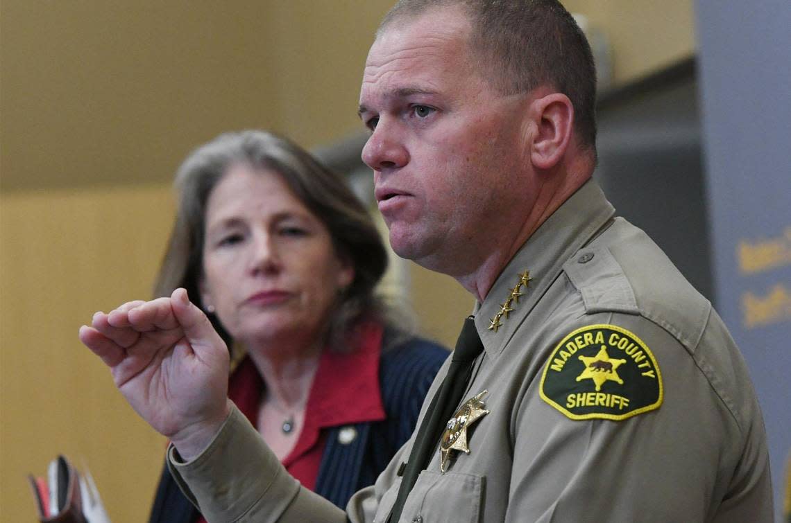 Madera County Sheriff Tyson Pogue, right, with Madera County DA Sally O. Morena, left, delivers an update for the ongoing Avenue 12 murder/suicide at a press conference Wednesday, afternoon Dec. 7, 2022 in Madera.