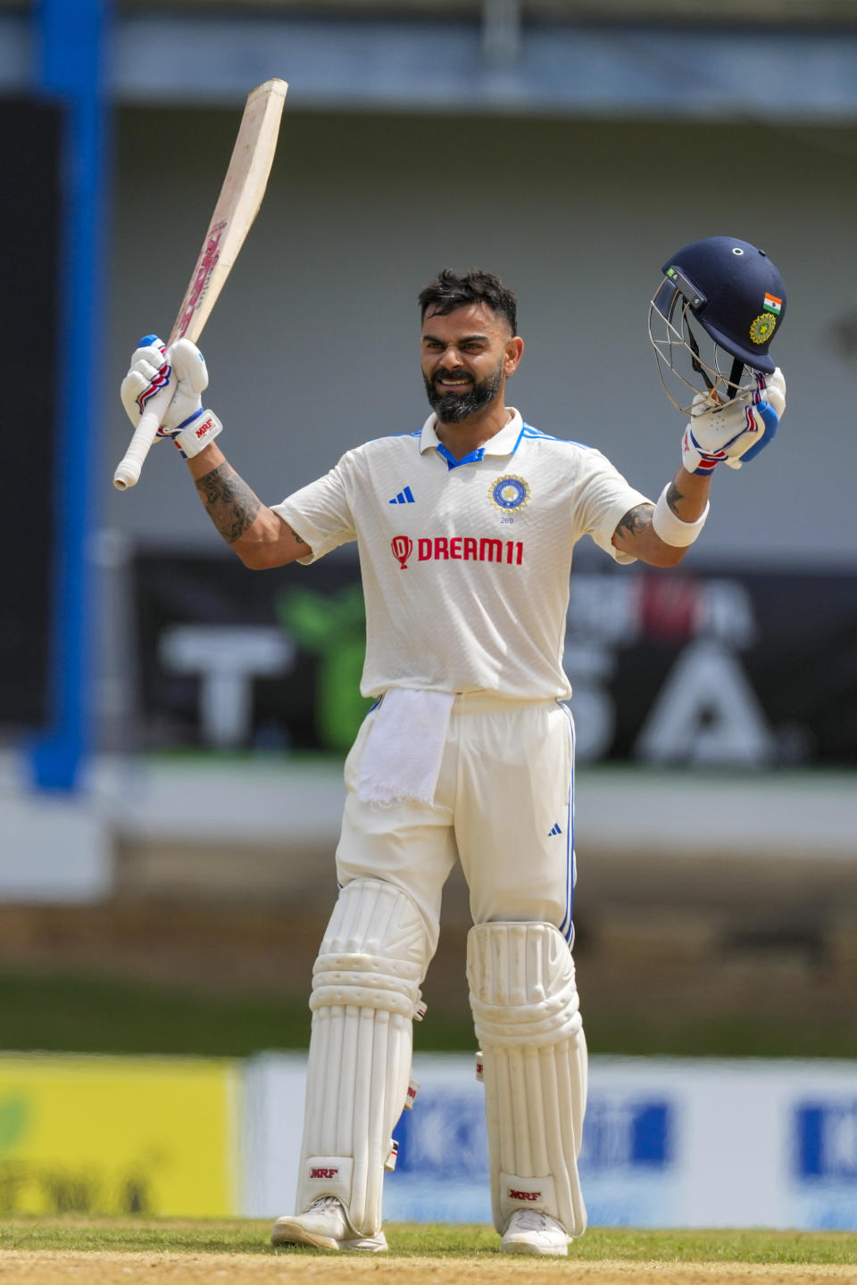 India's Virat Kohli celebrates after he scored a century against West Indies on day two of their second cricket Test match at Queen's Park in Port of Spain, Trinidad and Tobago, Friday, July 21, 2023. (AP Photo/Ricardo Mazalan)