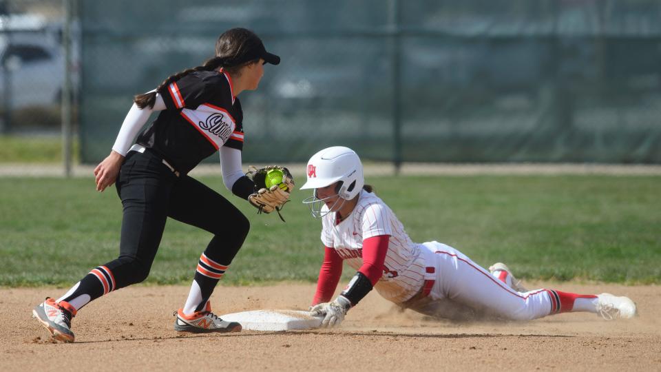 Oak Hills' Holly Medina slides into second base during the first inning on Thursday, March 30, 2023. Oak Hills defeated Apple Valley 5-0.