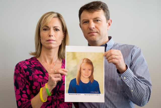 <p>LEON NEAL/AFP/Getty</p> Kate and Gerry McCann pose with an artist's impression of how their daughter might look at the age of nine on May 2, 2012.