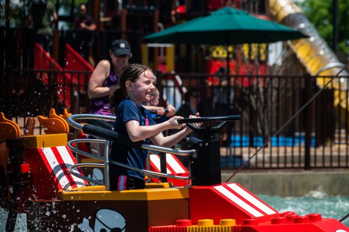 Claire Mawhiney, 7, from Oakland, NJ rides Rogue Riders at Legoland New York in Goshen, NY on Wednesday, June 15, 2022.