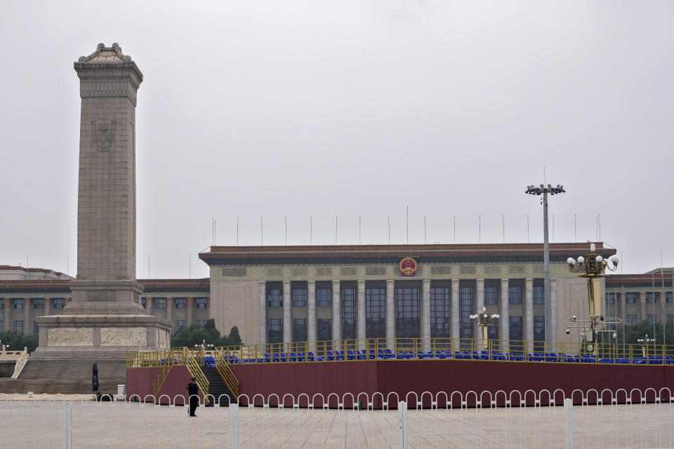 A security person stands near a raided seating platform setup in front of the Great Hall of the People on Tiananmen Square in Beijing on Wednesday, June 23, 2021. Chinese authorities have closed Beijing's central Tiananmen Square to the public, eight days ahead of a major celebration being planned to mark the 100th anniversary of the founding of the ruling Communist Party. (AP Photo/Andy Wong)