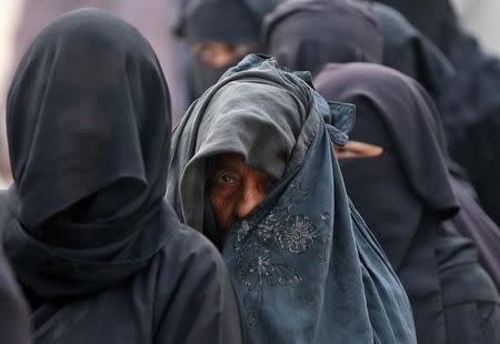 Women queue to vote during the state assembly election, in the town of Deoband, in the state of Uttar Pradesh, India, February 15, 2017. REUTERS/Cathal McNaughton