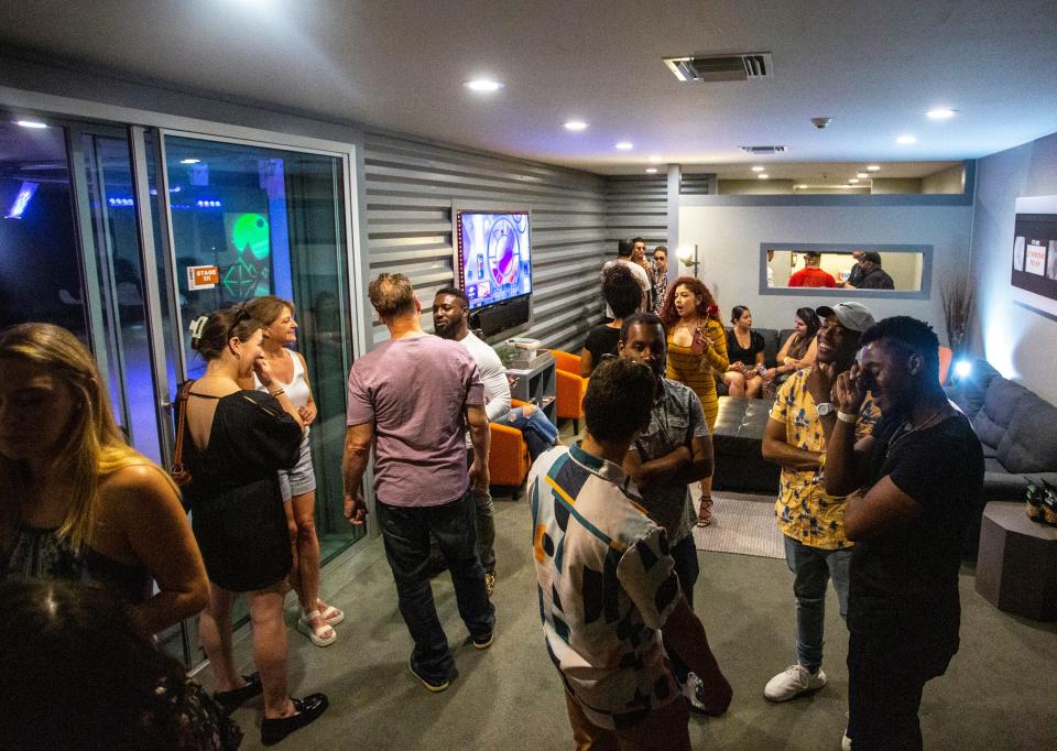 Guests mingle before music performances start during a Spotlight Sessions event at LevelOne11 in Palm Desert, Calif., Thursday, June 16, 2022. 