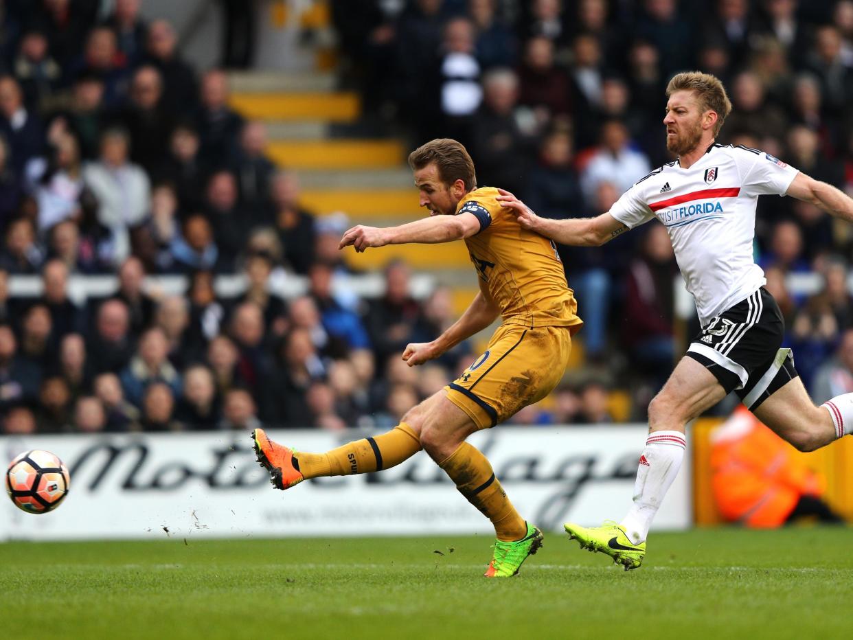 Kane fires his third goal past Fulham goalkeeper Bettinelli: Getty