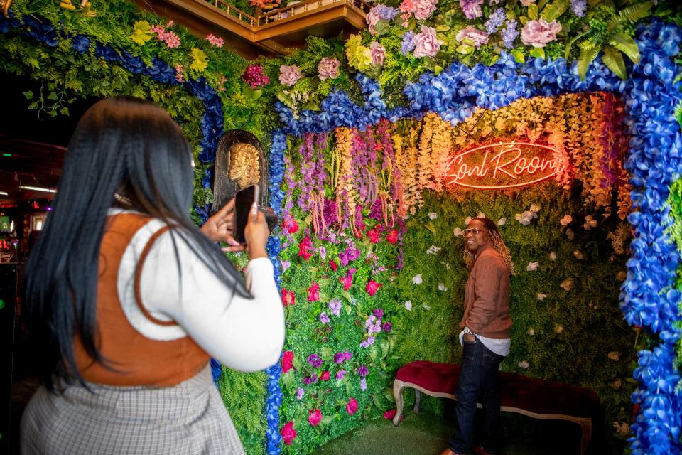 Kiki McCorale takes a picture of Shun Harris at Soul Nashville in one of their photo booths in West Nashville, Tenn., Saturday, Nov. 11, 2023.