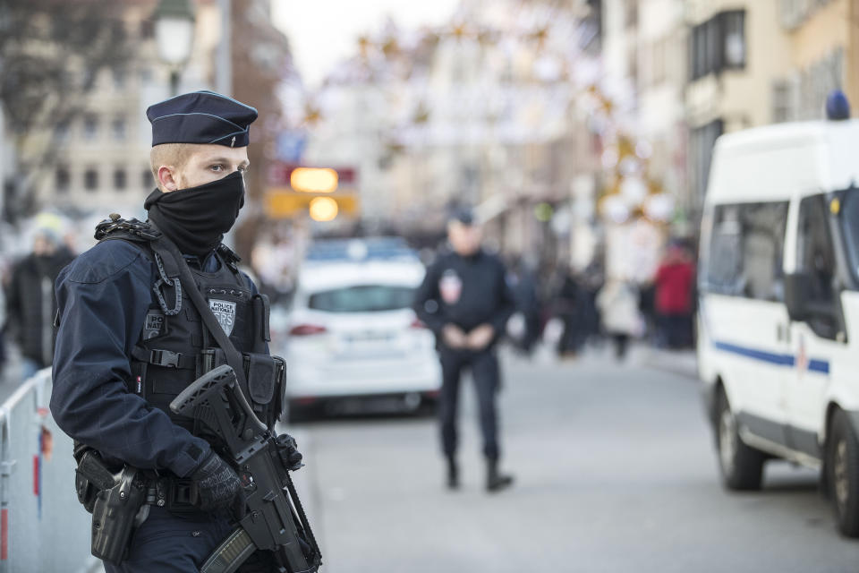 Strasbourg's Christmas market reopens under the protection of police as shoppers return to the market, in Strasbourg, France, Saturday Dec. 15, 2018. French police shot and killed the man who they believed attacked Strasbourg's Christmas market on Tuesday killing four people. (AP Photo/Jean-Francois Badias)