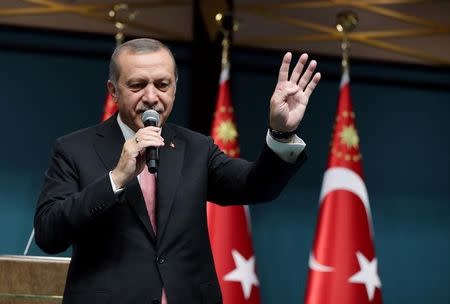 Turkish President Tayyip Erdogan addresses the nation in a live television broadcast from the presidential palace in Ankara, Turkey, July 21, 2016. Murat Cetinmuhurdar/Presidential Palace/Handout via REUTERS