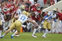 Oklahoma cornerback Tre Brown (6) takes a kickoff return for 86 yards past UCLA kicker J.J. Molson (17), Shea Pitts (47) defensive back Jay Shaw (24) in the first quarter of an NCAA college football game in Norman, Okla., Saturday, Sept. 8, 2018. (AP Photo/Sue Ogrocki)