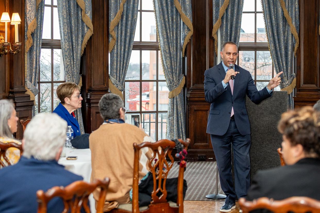 House Minority Leader Rep. Hakeem Jeffries, D-NY, speaks Toledo at a reception at the Toledo Club. Rep. Marcy Kaptur, D-Toledo, in blue, listens in the front row.