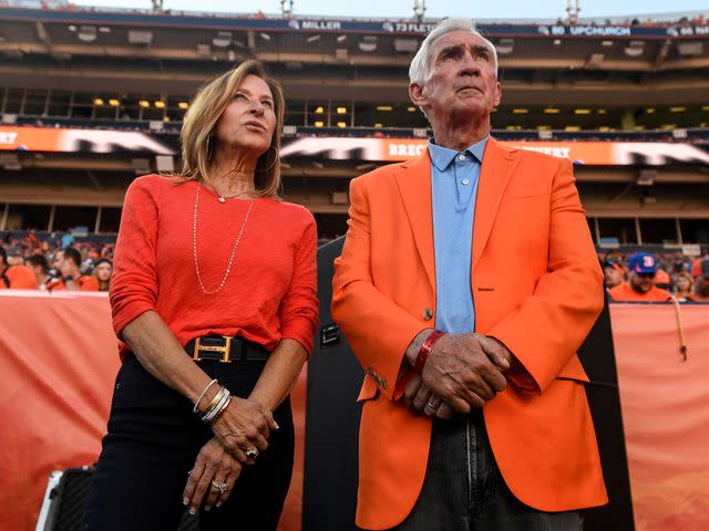 <p>Aaron Ontiveroz/MediaNews Group/The Denver Post/Getty</p> Mike Shanahan and his wife Peggy Shanahan before his induction into the team"u2019s Ring of Fame on Sunday, October 17, 2021.