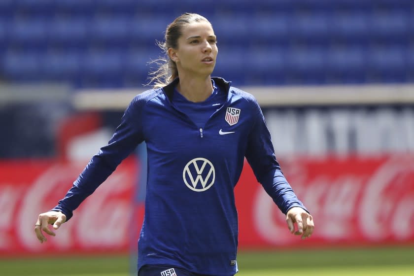 FILE - In this May 25, 2019, file photo, United States forward Tobin Heath warms up during a soccer workout at Red Bull Arena, in Harrison, N.J. U.S. national team players Megan Rapinoe, Tobin Heath and Christen Press have opted out of the National Women's Soccer League tournament kicking off this weekend in Utah. Heath and Press, who played with Rapinoe on the champion World Cup team last summer in France, cited concerns about the coronavirus for their decisions not to play.(AP Photo/Steve Luciano, File)