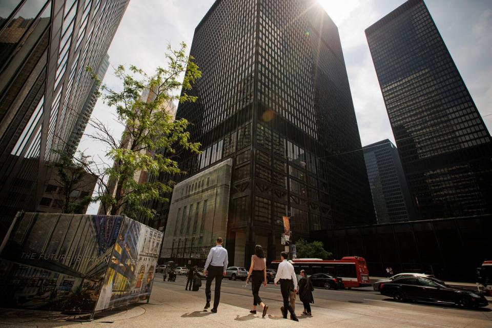 People walk through Toronto’s financial district on June 1, 2022. The Bank of Canada raised its benchmark interest rate to 1.5 per cent in an anticipated move to curb pandemic-era inflation.