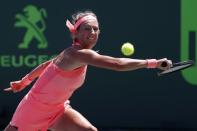 Mar 29, 2018; Key Biscayne, FL, USA; Victoria Azarenka of Belarus reaches for a backhand against Sloane Stephens of the United States (not pictured) in a women's singles semi-final of the Miami Open at Tennis Center at Crandon Park. Mandatory Credit: Geoff Burke-USA TODAY Sports