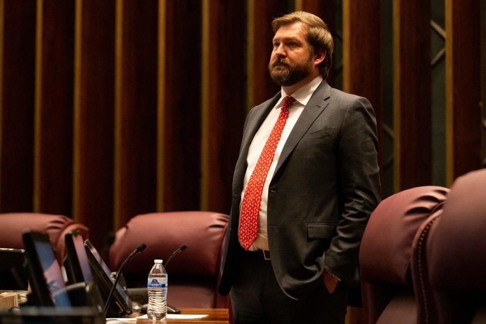 Councilman Chase Carlisle stands by his chair prior to the start of a Memphis City Council meeting on Tuesday, April 11, 2023. Two items on the agenda were police reform ordinances. The “Achieving Driving Equality” ordinance passed while the other, which had opposition from advocates and questions from council members as to whether it was redundant, was tabled indefinitely. 