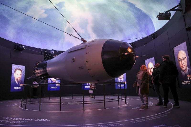 Visitors look at a model of a Soviet AN-602 thermonuclear aerial bomb also known as the Tsar Bomb, the most powerful nuclear weapon ever created and tested, as they visit the Atom pavilion, a permanent exhibition centre designed to demonstrate Russia’s main past and modern achievements of the nuclear power industry, at the All-Russia Exhibition Centre (VDNH) in Moscow on November 4, 2023. 