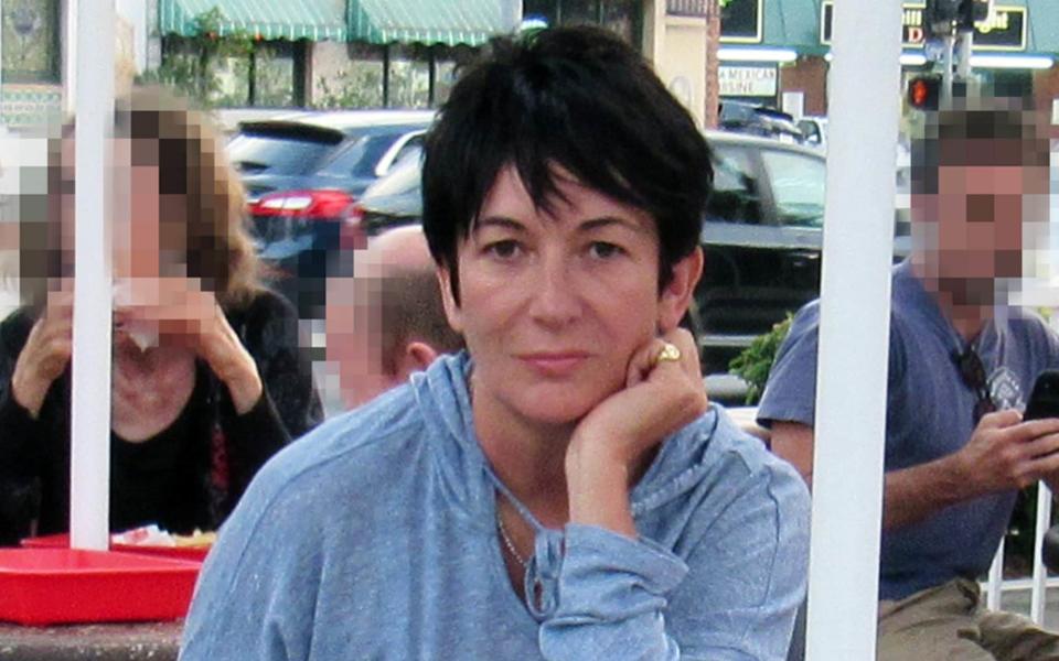 Ghislaine Maxwell tucks into burger and fries at a fast-food joint in Los Angeles, in 2019. Ms Maxwell, 57, was the alleged 'madam' to the multi-millionaire paedophile Jeffrey Epstein. She is due to stand trial later this year - Mega Agency