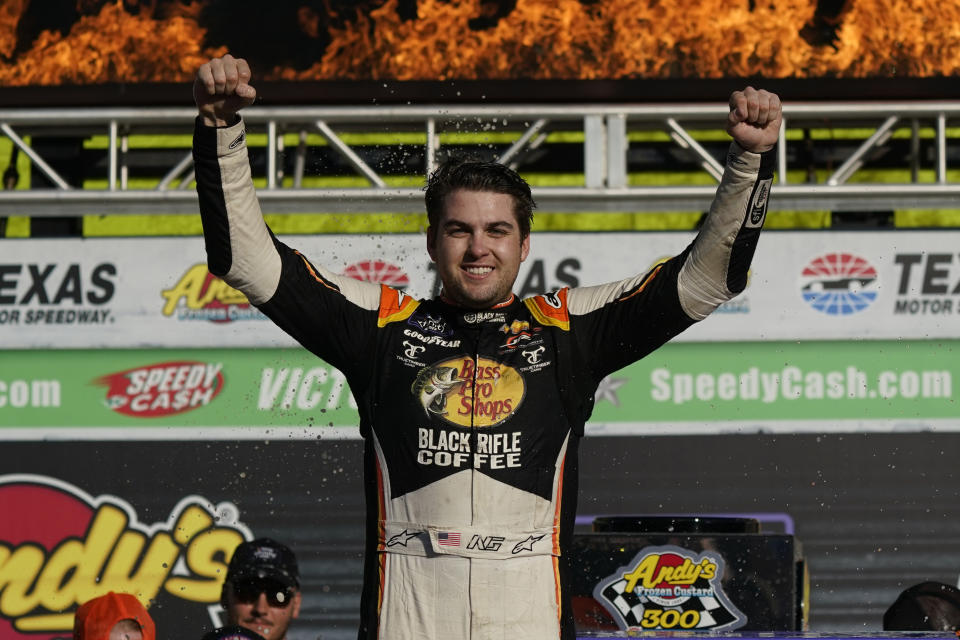 Noah Grayson (9) celebrates with his crew in Victory Lane after winning the NASCAR Xfinity Series auto race at Texas Motor Speedway in Fort Worth, Texas, Saturday, Sept. 24, 2022. (AP Photo/LM Otero)