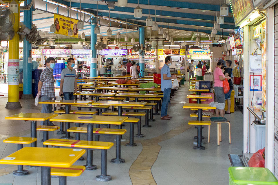 People seen queueing for food at the Zion Riverside Food Centre on 5 May 2020. (PHOTO: Dhany Osman / Yahoo News Singapore)