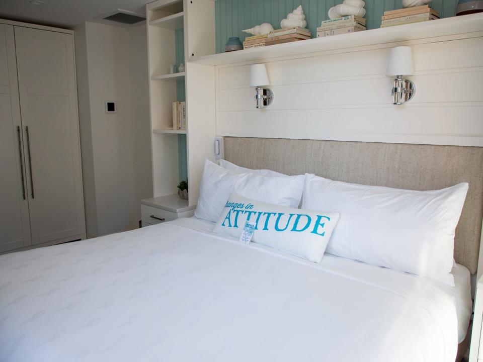 a bed with beach-themed decor