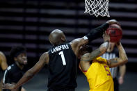 Maryland guard Eric Ayala, right, is fouled by Michigan State guard Joshua Langford during the second half of an NCAA college basketball game, Sunday, Feb. 28, 2021, in College Park, Md. Maryland won 73-55. (AP Photo/Julio Cortez)