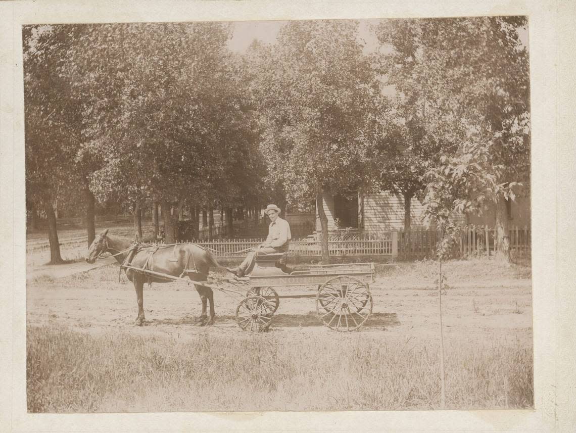 Zoe Anderson Norris came to Wichita with her first husband, Spencer, seen here with his delivery wagon.