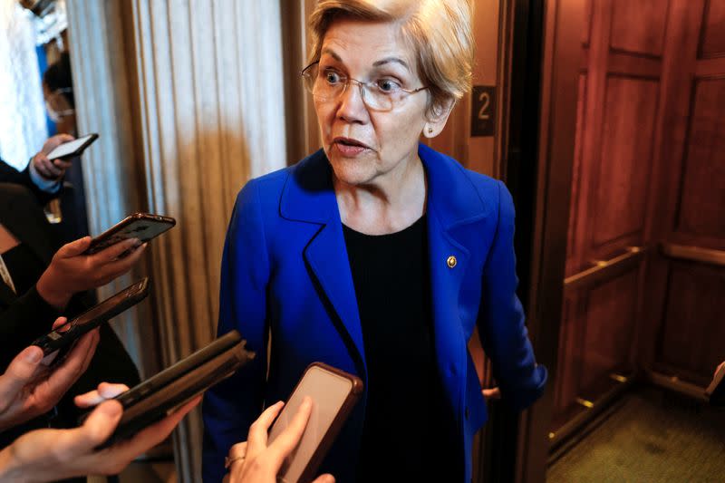 FILE PHOTO: Senator Elizabeth Warren speaks to reporters on Capitol Hill in Washington