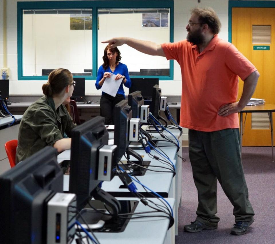 Scott Brielmaier (right) teaches computer science at Hortonville High School, assisted by Erin Draheim (in back), a software engineer who lives in the community.