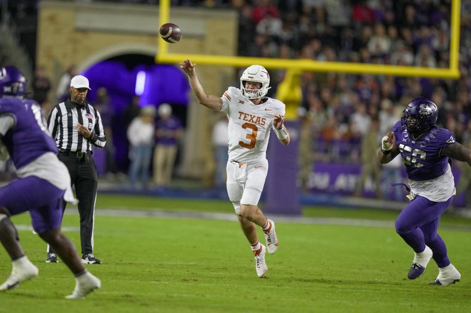 Texas Longhorns quarterback Quinn Ewers (3) passes the ball against TCU Horned Frogs defense in the second quarter of an NCAA college football game, Saturday, November. 11, 2023, at Amon G. Carter Stadium in Fort Worth, Texas.