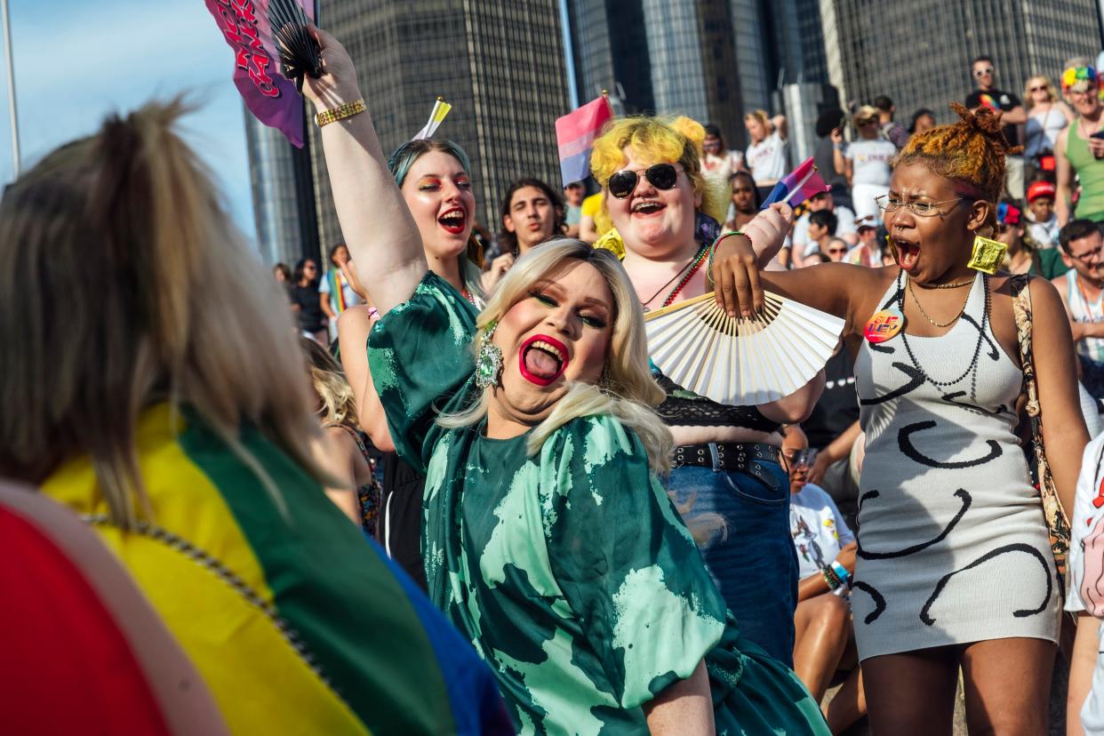 Jared Waltrip aka Bentley James of Lansing is cheered on by the crowd while helping with trivia questions on Saturday, June 11, 2022, during a drag show at the main stage of the Motor City Pride Festival at Detroit's Hart Plaza.