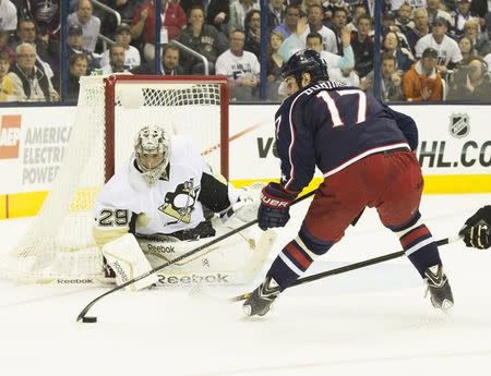 Columbus Blue Jackets center Brandon Dubinsky (17) controls the puck against Pittsburgh Penguins goalie Marc-Andre Fleury (29) in game six of the first round of the 2014 Stanley Cup Playoffs at Nationwide Arena. April 28, 2014; Columbus, OH, USA; Greg Bartram-USA TODAY Sports
