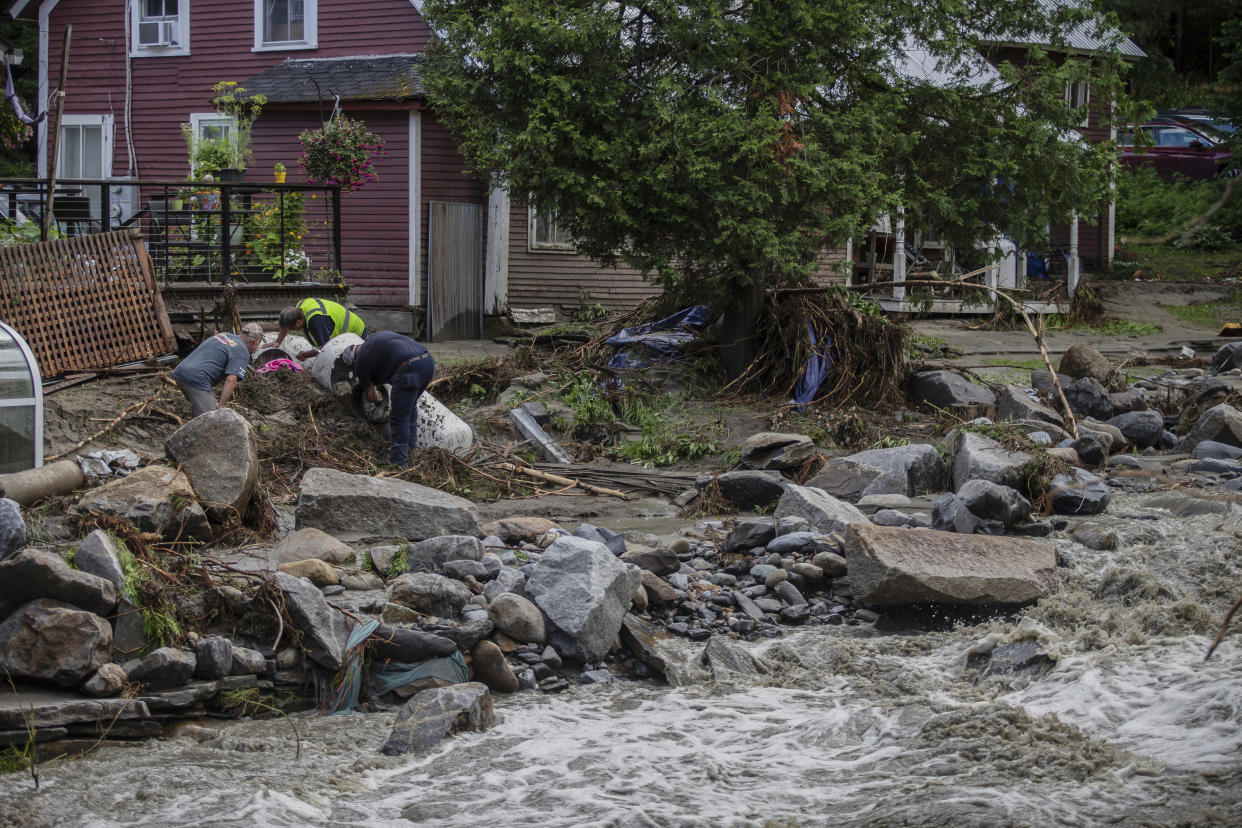 Residents clean up following flooding.