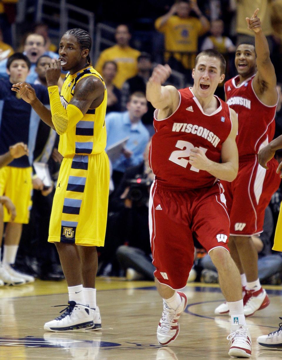 Wisconsin's Josh Gasser reacts after a late Marquette turnover with Dwight Buycks in the background in 2010 in Milwaukee.