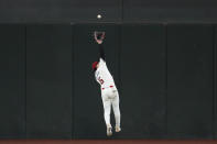 Arizona Diamondbacks center fielder Alek Thomas makes a leaping catch on a fly ball hit by Colorado Rockies' Elehuris Montero during the fourth inning of a baseball game Thursday, March 28, 2024, in Phoenix. (AP Photo/Ross D. Franklin)