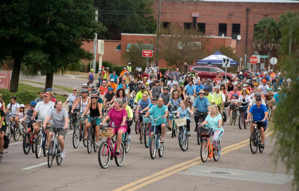 Bikers cruise along Gregory Street Saturday, October 12, 2019 during Bike Pensacola's October Slow Ride.