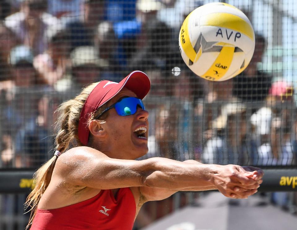 The volleyball is reflected in April Ross' sunglasses as she returns a shot during an ATP beach volleyball game in August 2019 in Manhattan Beach, Calif. Ross is among the athletes featured in the BYB Pictures documentary series, "AVP Uncovered: Best of the Beach," which is to debut on Thursday night on YouTube.