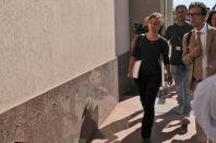 Sea-Watch3 German captain Carola Rackete is accompanied by her lawyer Leonardo Marino, right, as she arrives for questioning in court in the southern Sicilian town of Agrigento, Italy, Thursday, July 18, 2019. Rackete, who forced a government block docking at an Italian port after rescuing migrants, faces questioning by Italian prosecutors over allegedly aiding illegal immigration. (Pasquale Claudio Montana Lampo/ANSA via AP)