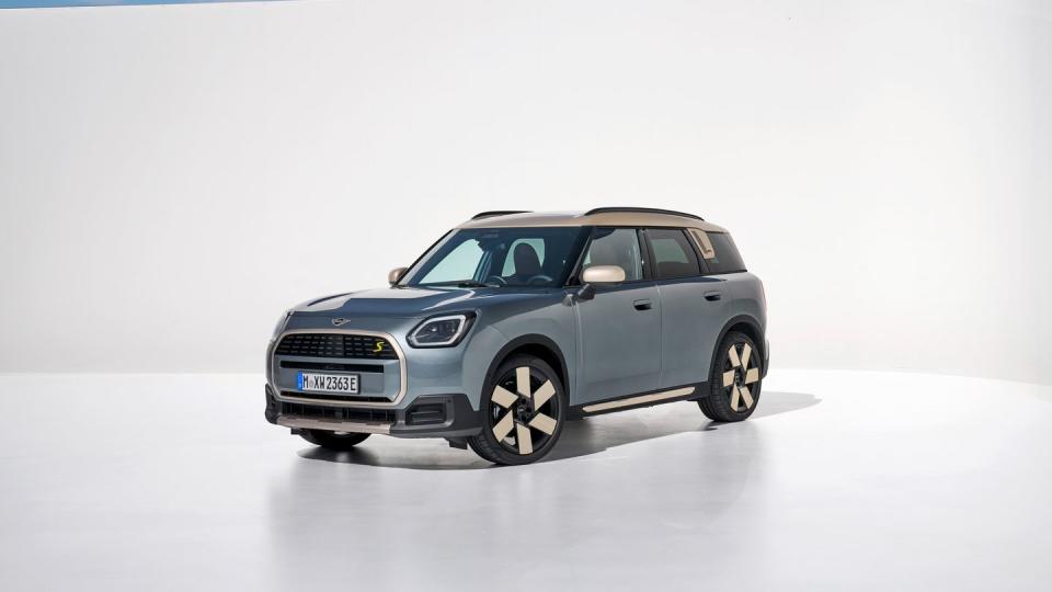 2025 mini cooper countryman electric in light blue with a cream and black interior