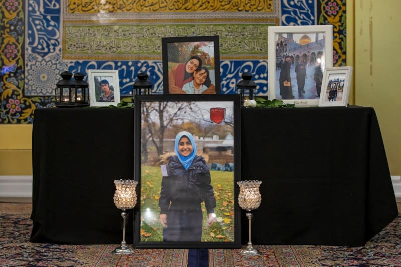 Mourners attend a memorial for the victims of a Ukrainian passenger jet which was shot down in Iran